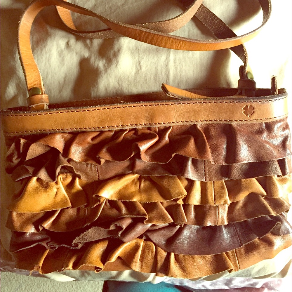 Cute Lucky Brand brown ruffle cross body purse.