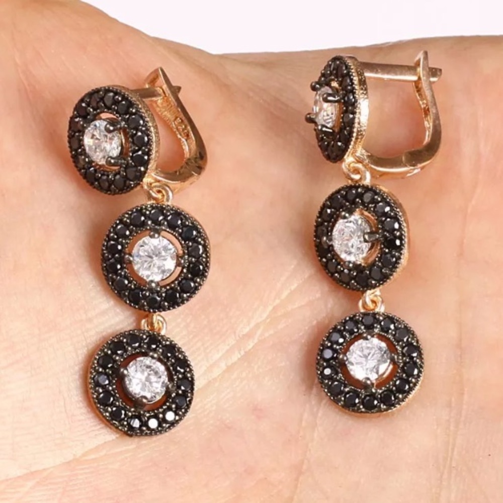 Three dangling circles w/black onyx white Topaz SS