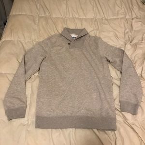 Medium grey formal attire pullover with button.