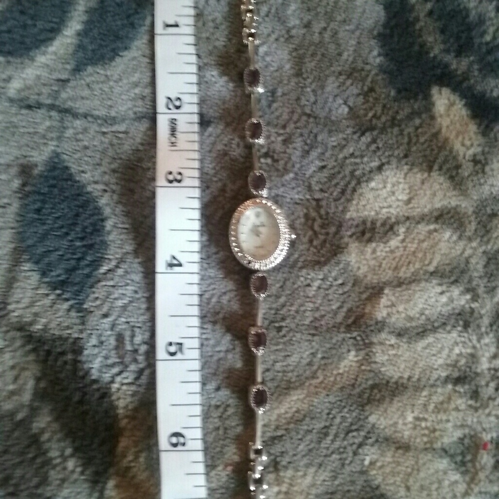 Vanity Fair, pearl faced with amethyst accents