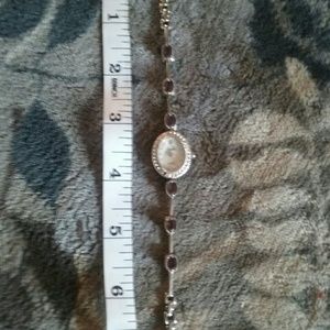 Vanity Fair, pearl faced with amethyst accents