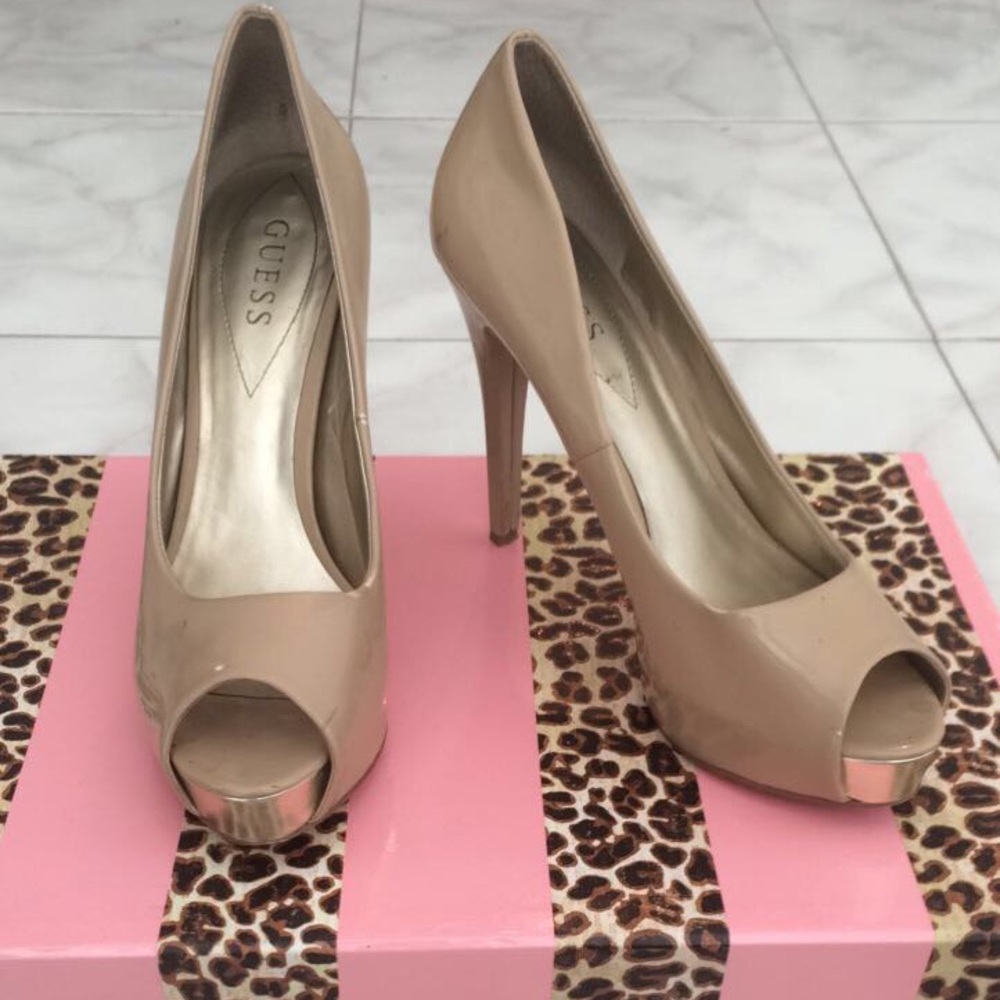Nude open-toe heels.
