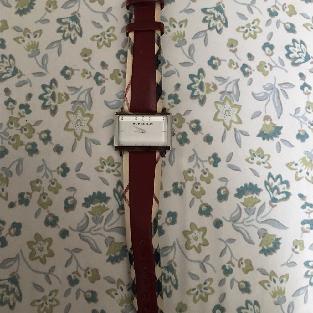 Red plaid Burberry watch.