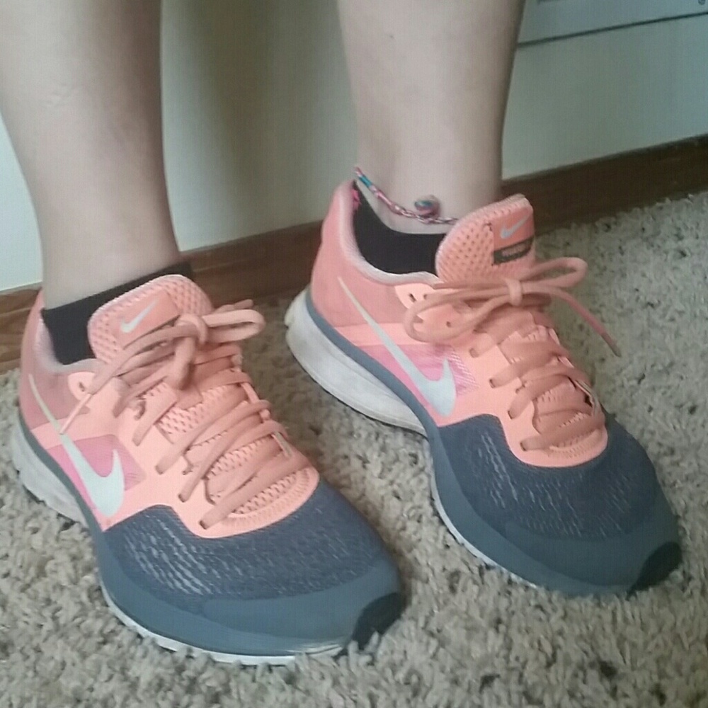 Coral and gray Nike shoes