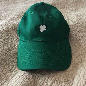 Green baseball cap.