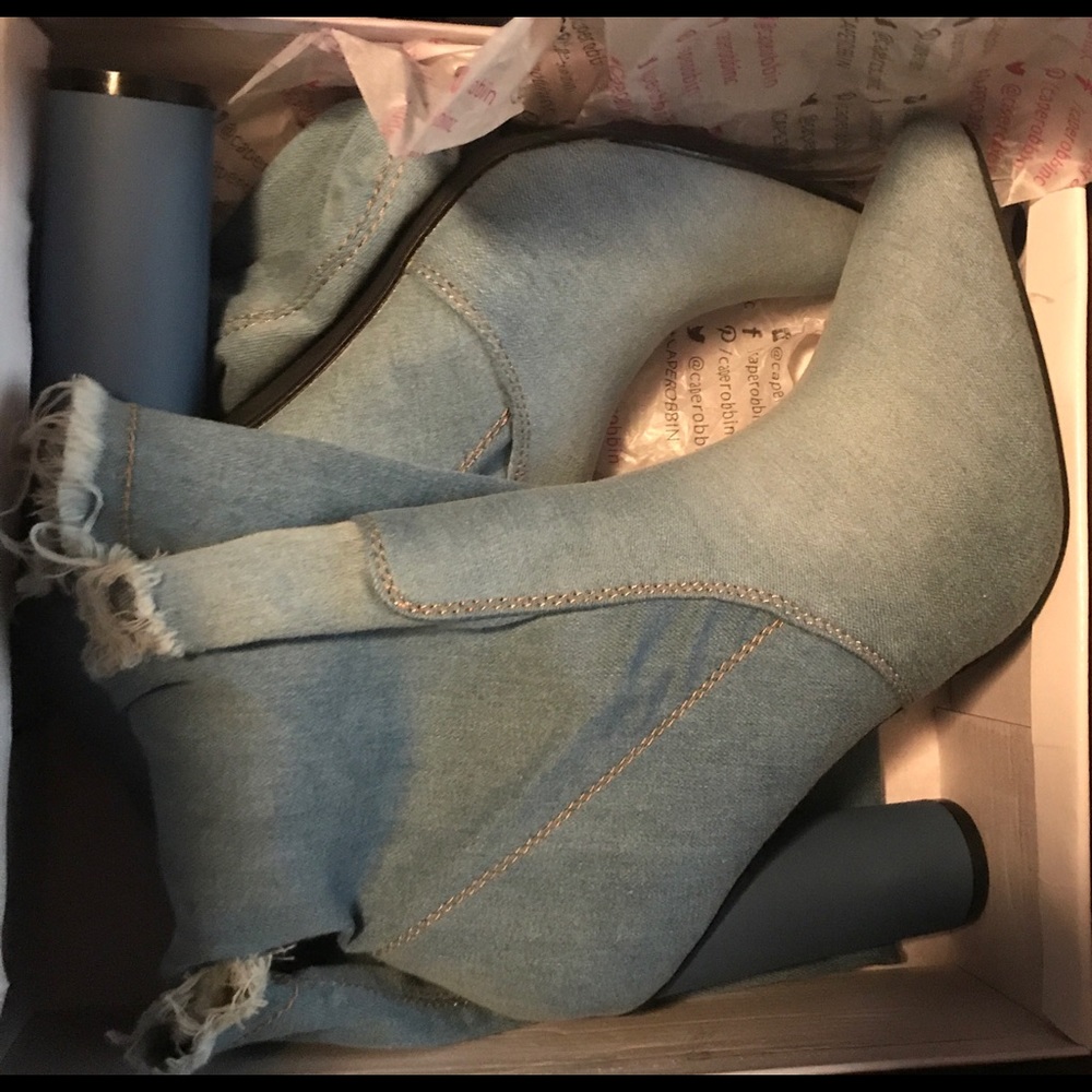 Distressed denim boots