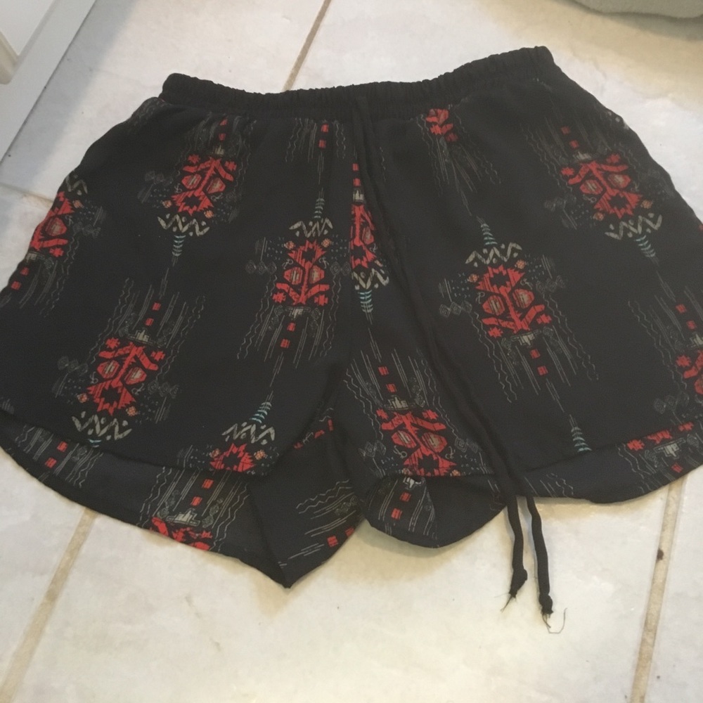 Black shorts with tribal patterns