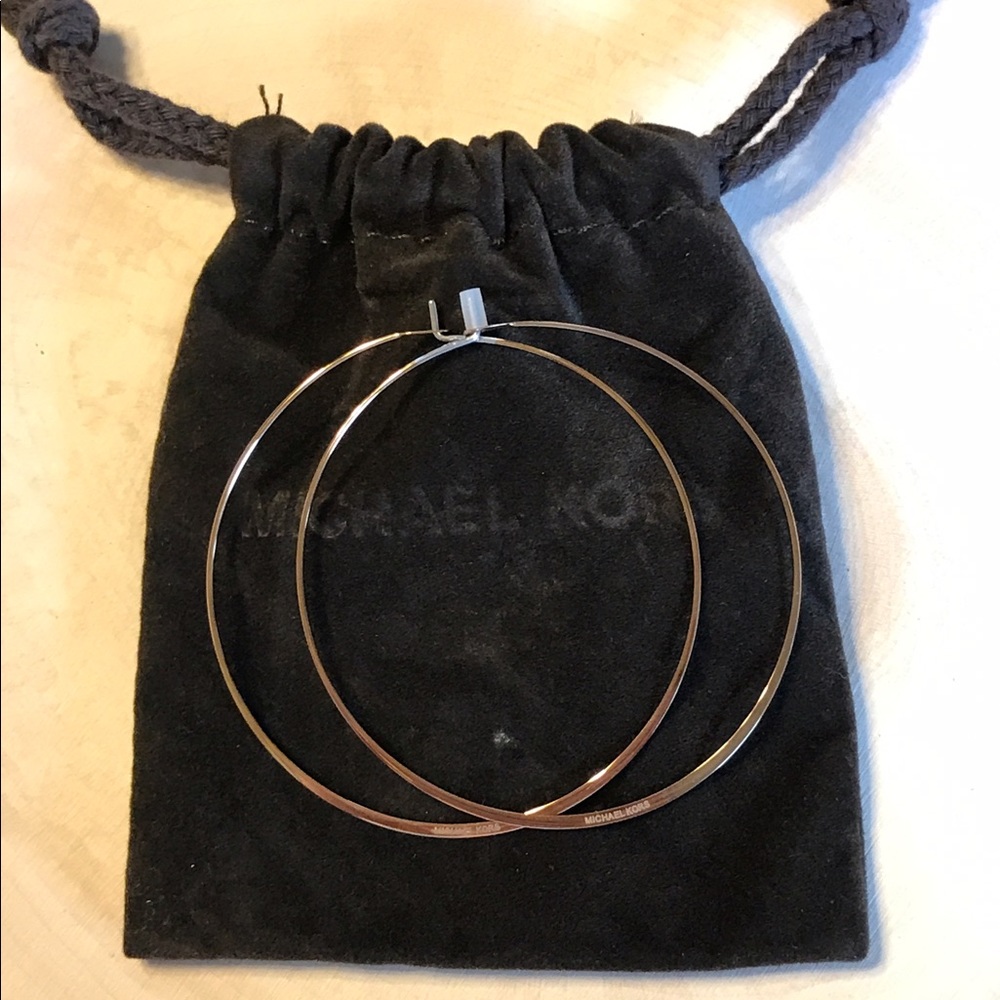 Michael Kors authentic bronze hoop earrings.