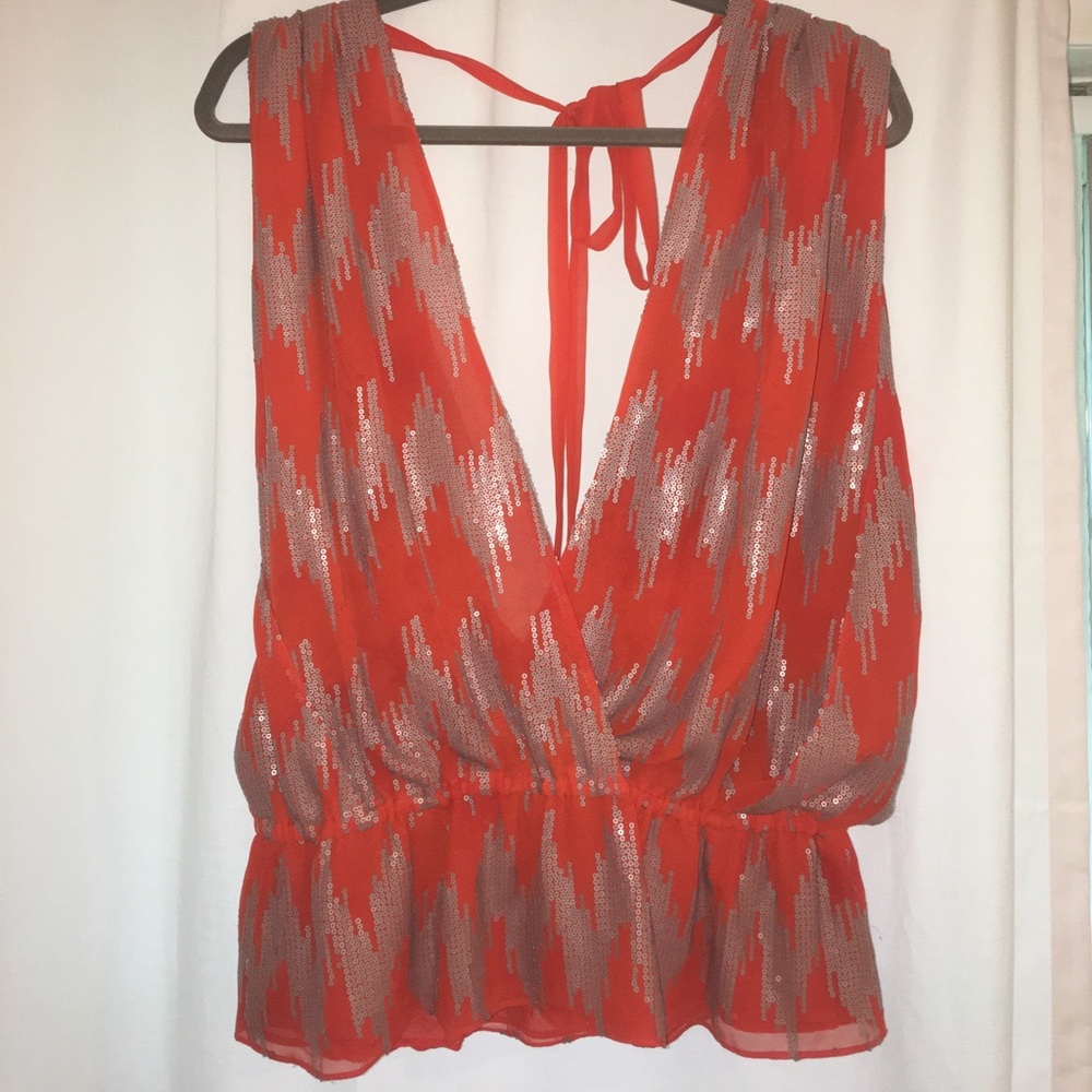 Orange and silver sequined blouse