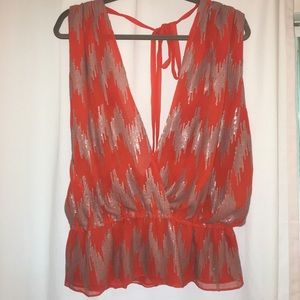 Orange and silver sequined blouse