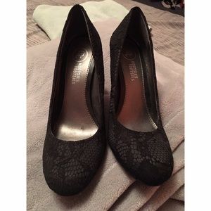 Black lace high heel pumps