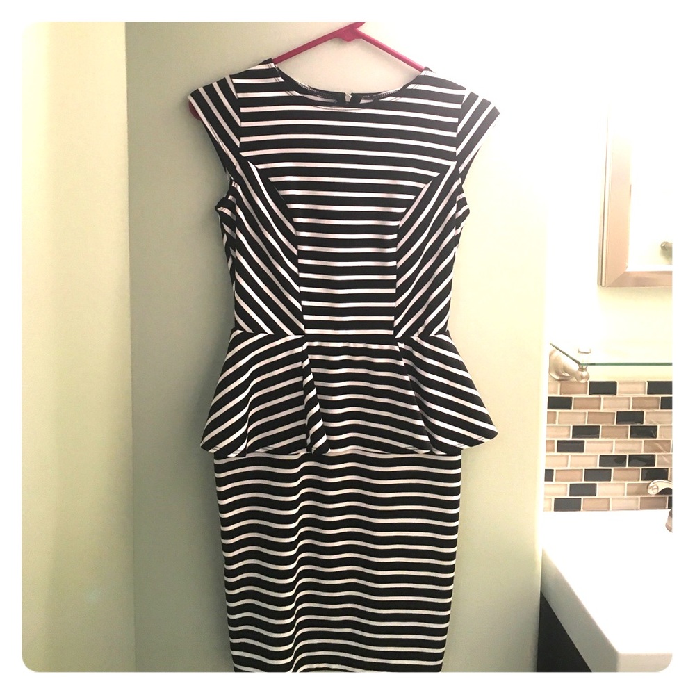 Black and white peplum dress. Fitted.