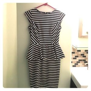 Black and white peplum dress. Fitted.