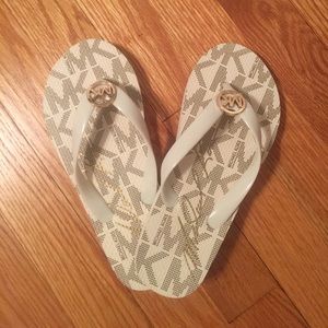 Michael Kors white flip flops