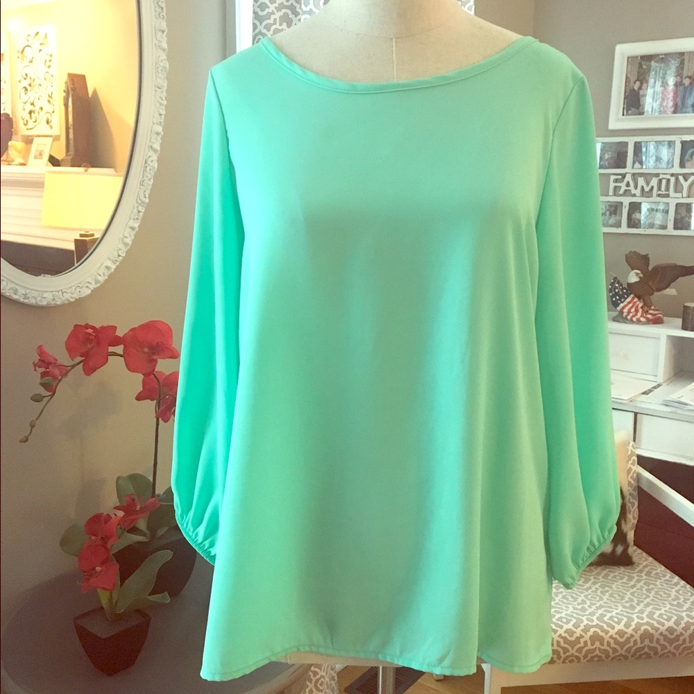 Medium light aqua blouse with bow on back