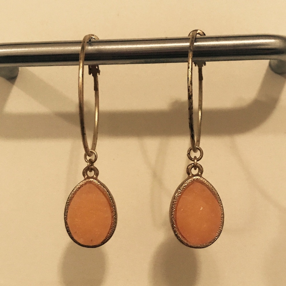 Gold hoop earrings with coral droplets