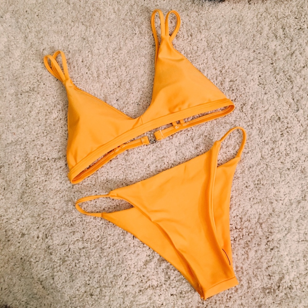 On hold. NEVER BEEN WORN Bright Orange Bikini