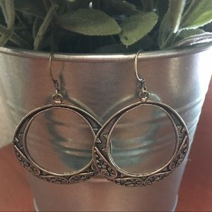 Intricate silver hoop earrings