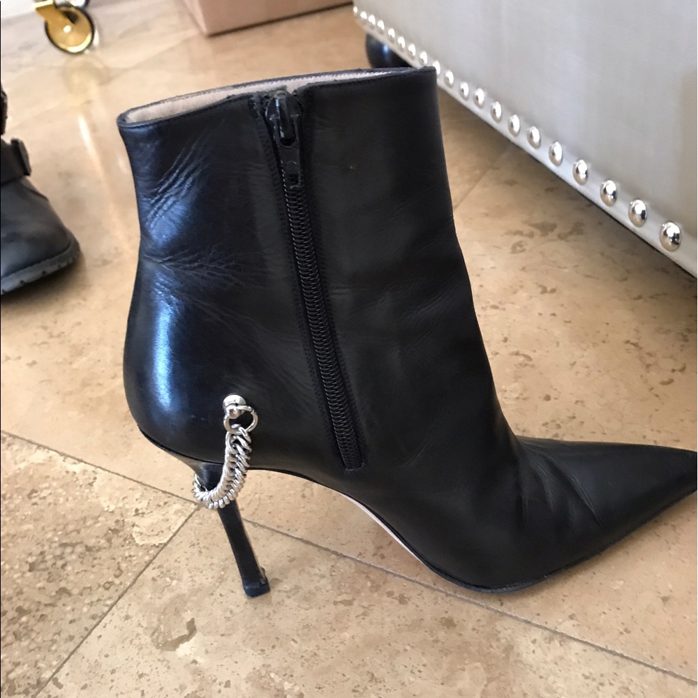 Barely worn Manolo booties black leather w/ chain