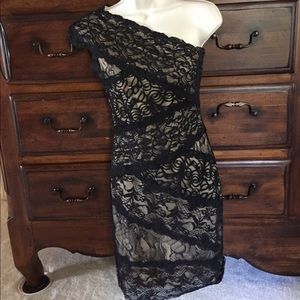 Black lace on nude one shoulder dress