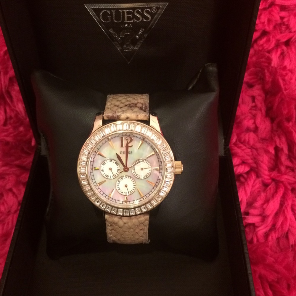 Gold encrusted with crystals Guess watch.
