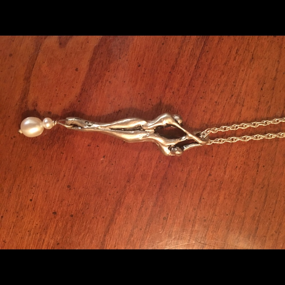 Sterling silver and pearl embrace necklace