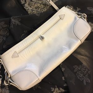 The white Donald J. Pliner clutch it's no surprise