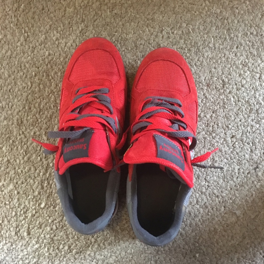 Orange and Grey Saucony Shadow barley worn.