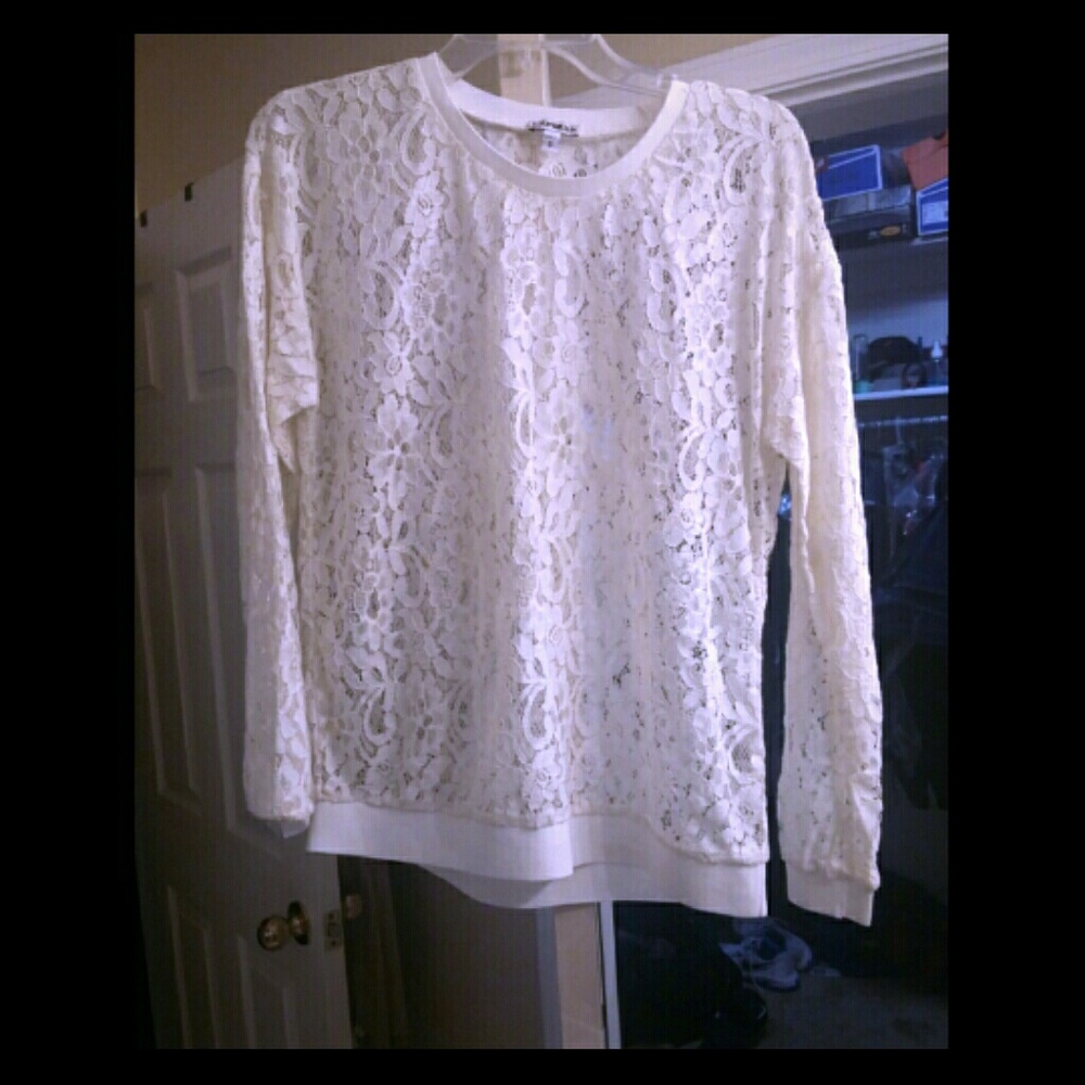 Ivory colored see-through blouse..