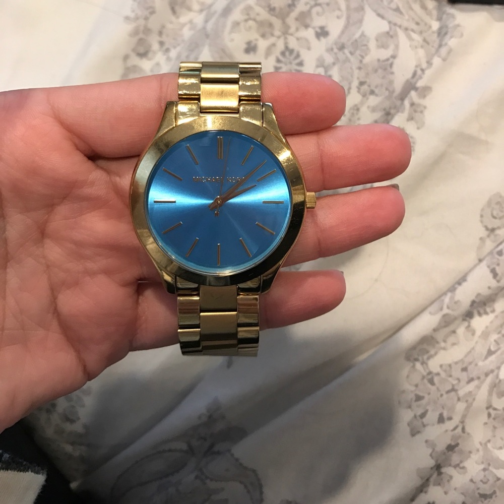 Gold michael kors watch with turquoise face