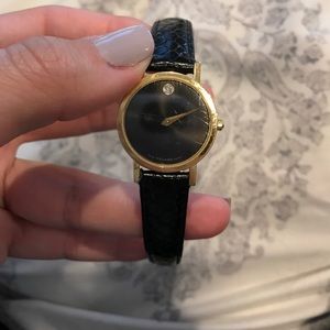 Black and gold Movado watch