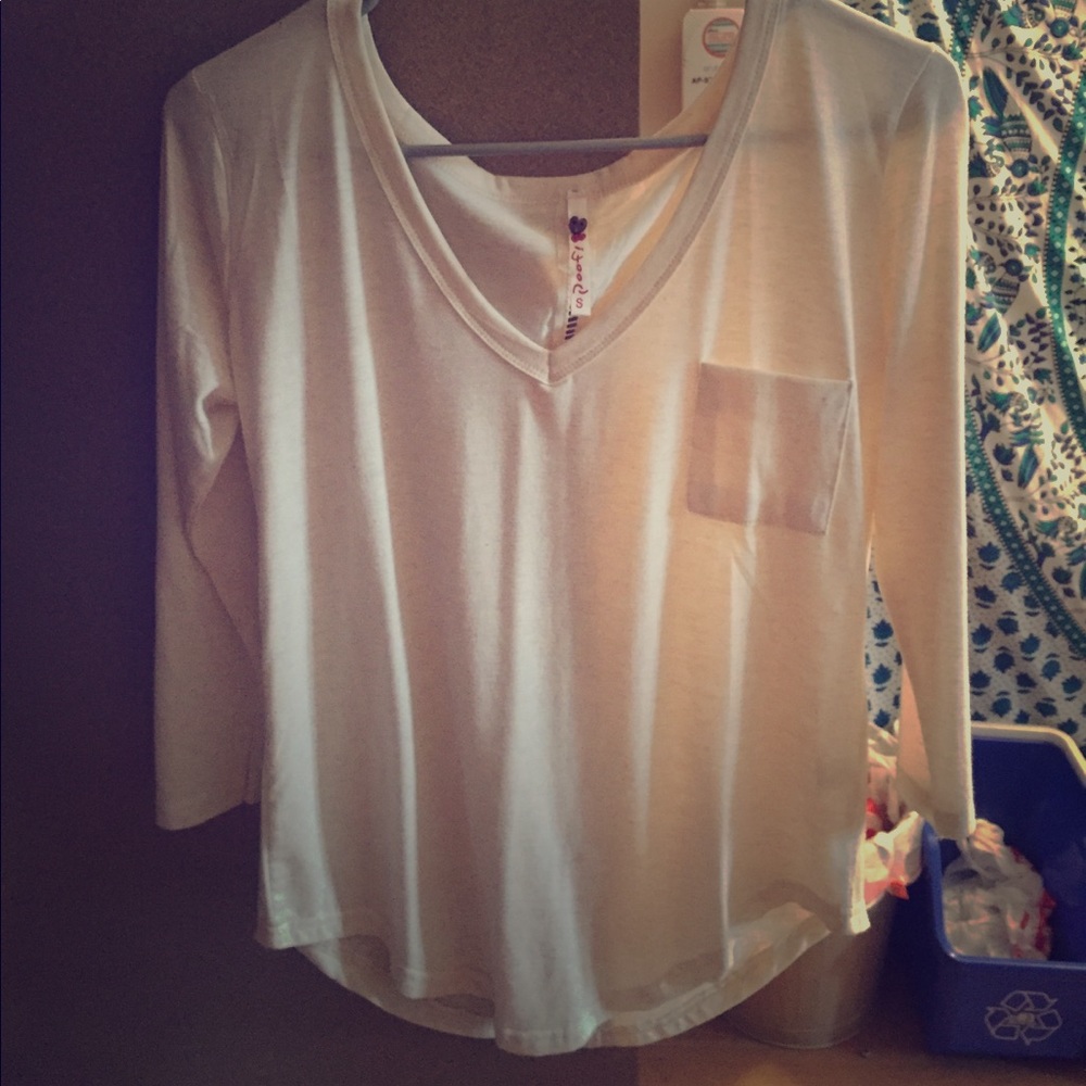 Cream colored, 3/4 sleeves v-neck shirt