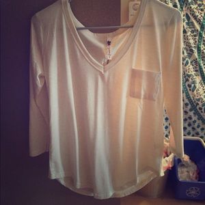 Cream colored, 3/4 sleeves v-neck shirt