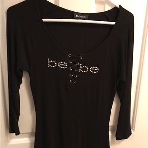 Bebe 3/4 length shirt. Never worn out only try on