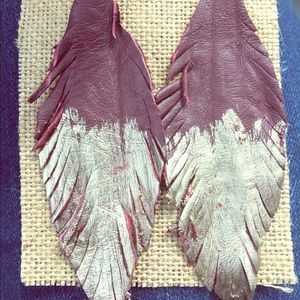 So fetching leather feather earrings