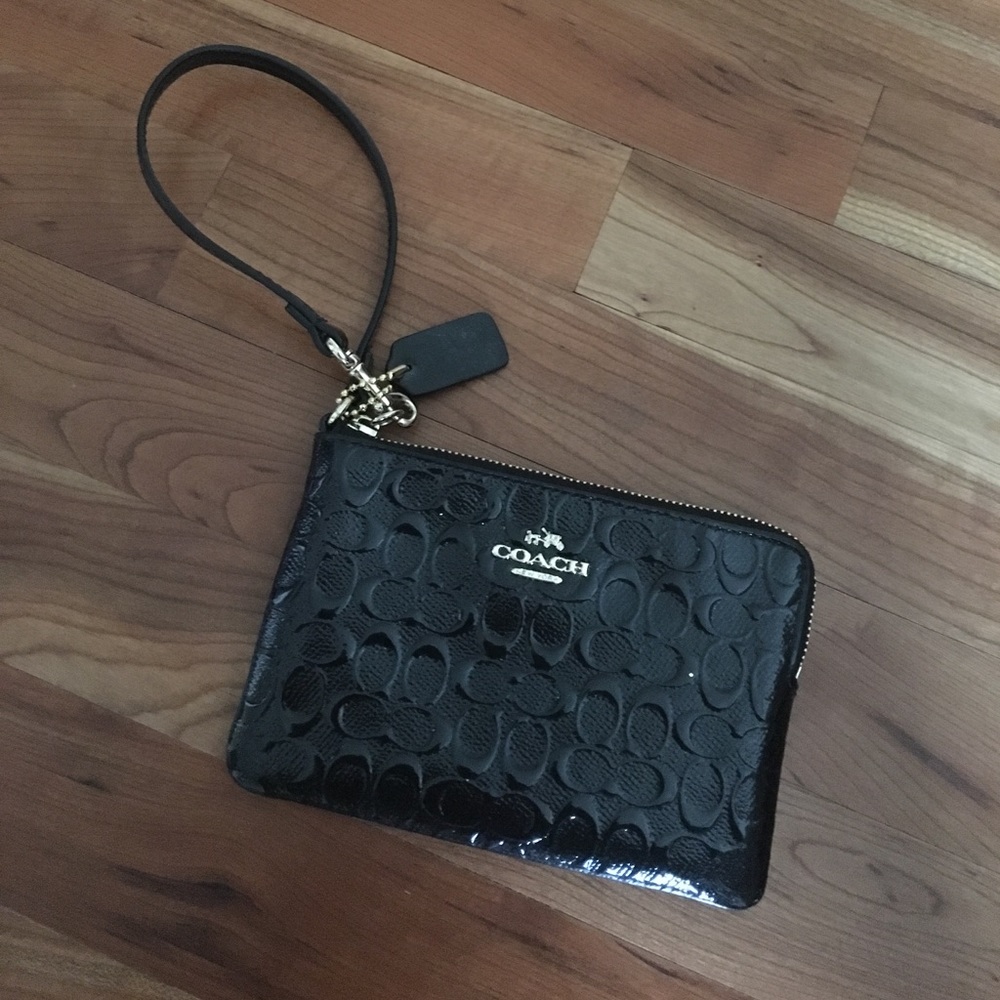 Small black patent leather coach wristlet