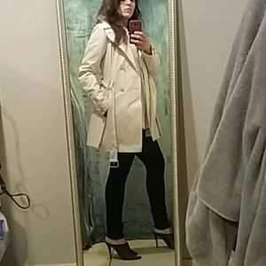 Cream colored spring trench style coat.