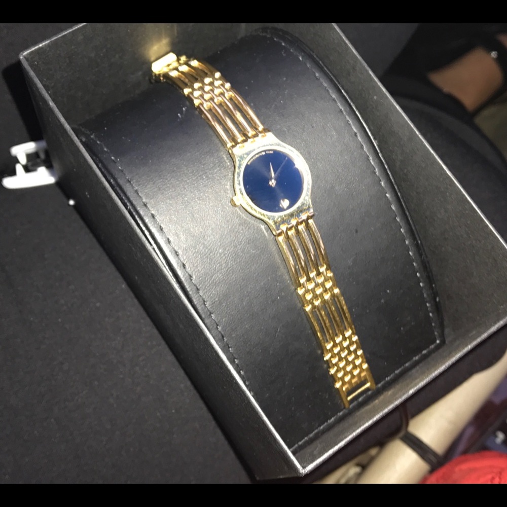 GOLD MOVADO WACH Would totally compromise $