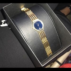 GOLD MOVADO WACH Would totally compromise $