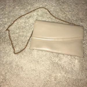 Cream large clutch shoulder strap
