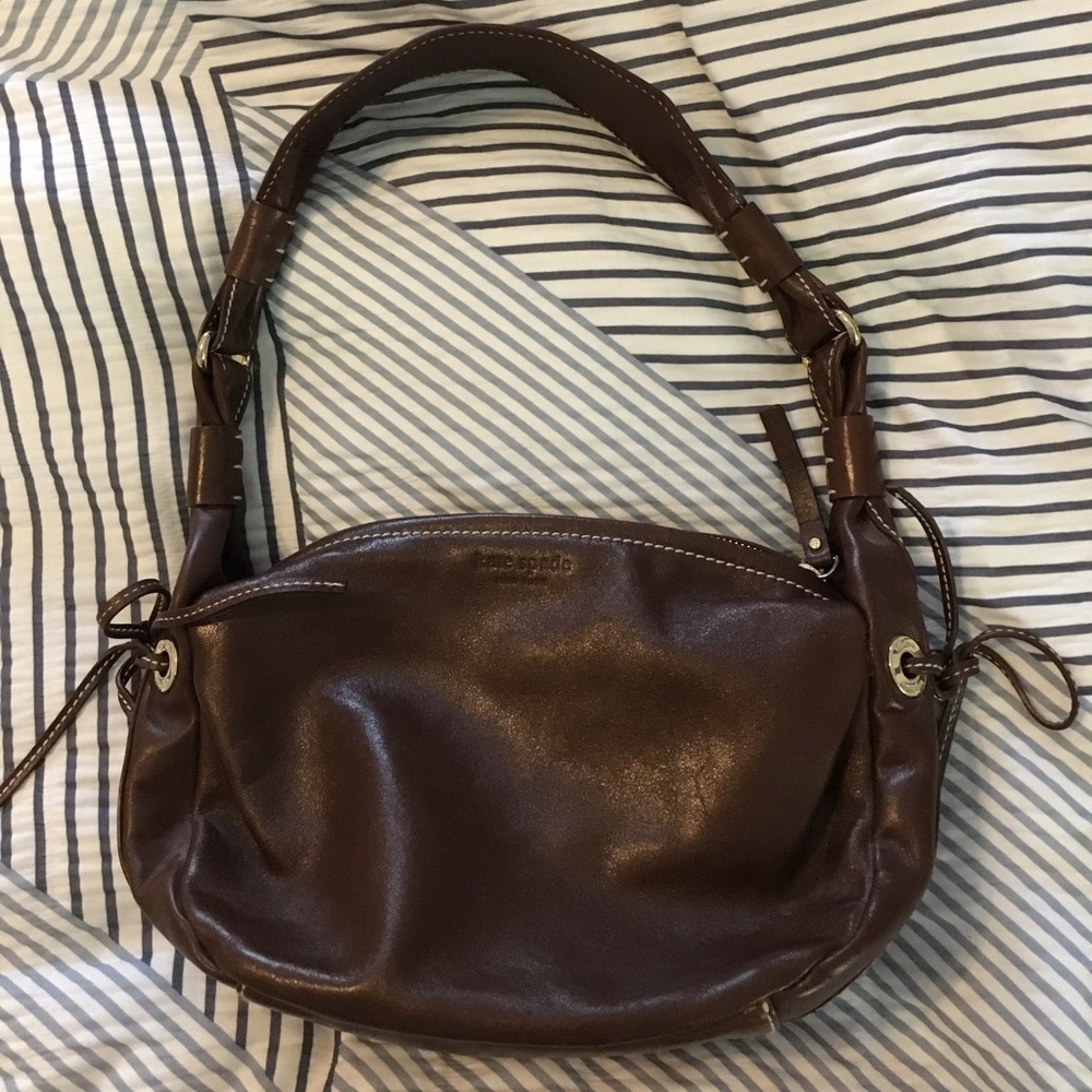 Dark brown leather kate spade purse.