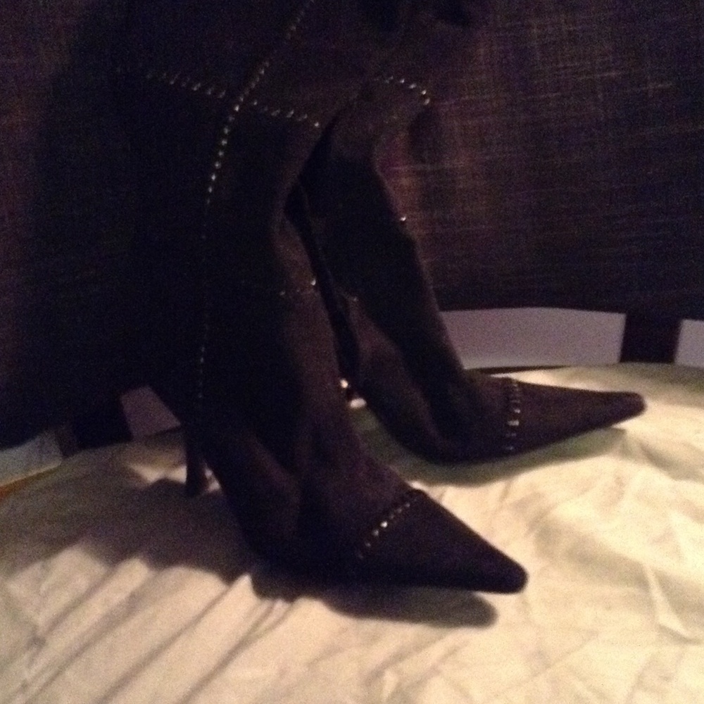 Black suede boots with patent running through it.