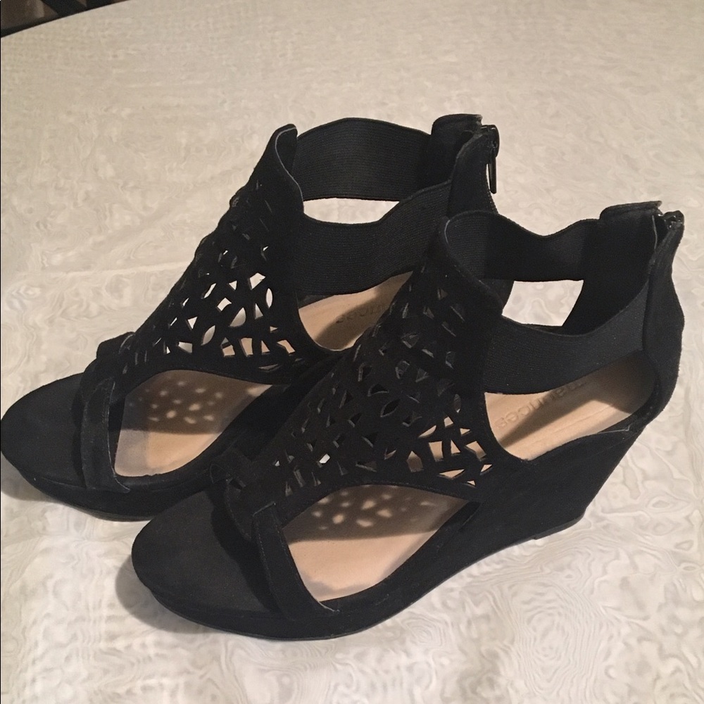 Black wedges worn once .