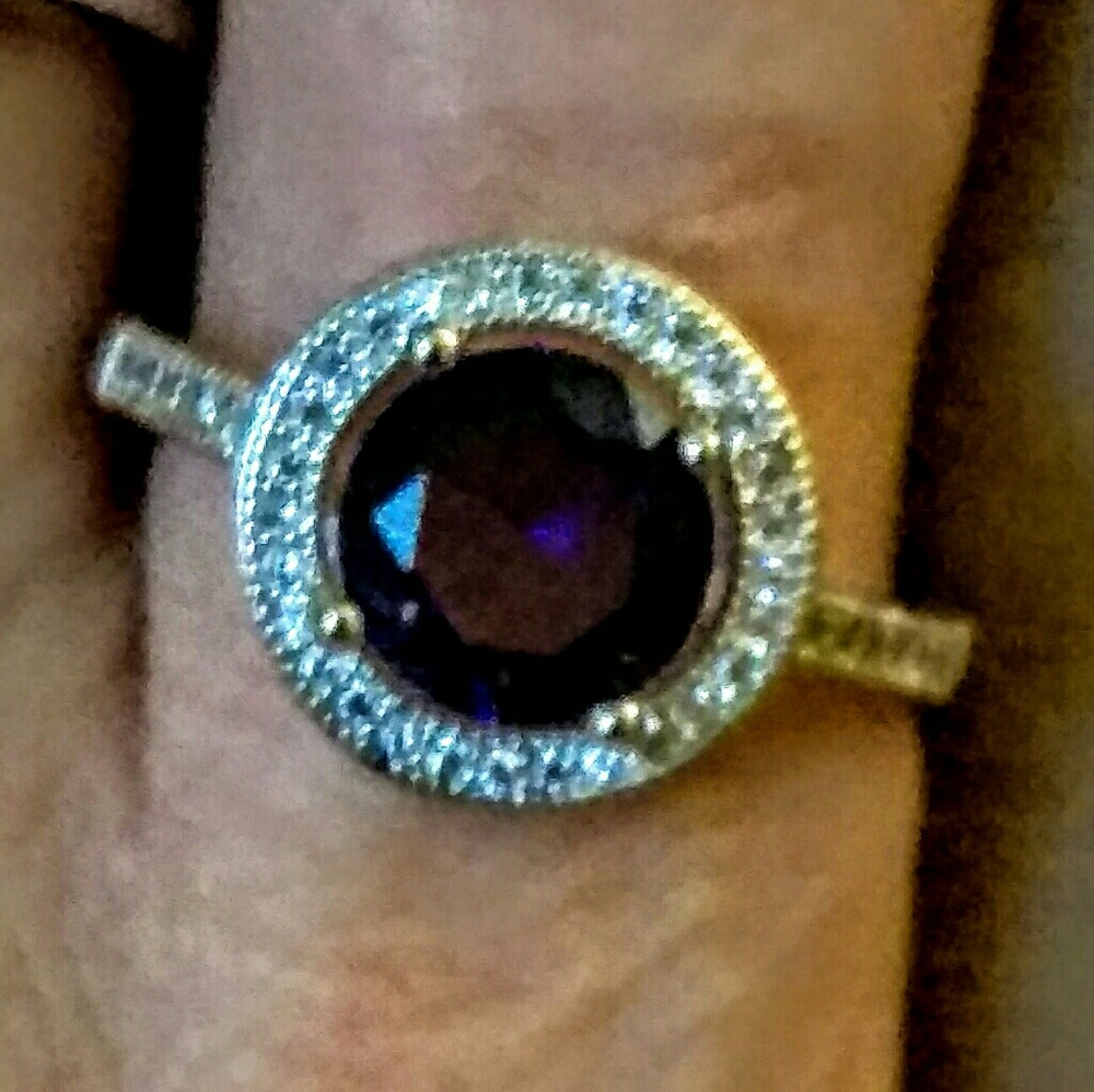 Garnet surrounded by diamonds on Sterling Silver r