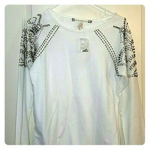 White top with gold detailing on sleeves