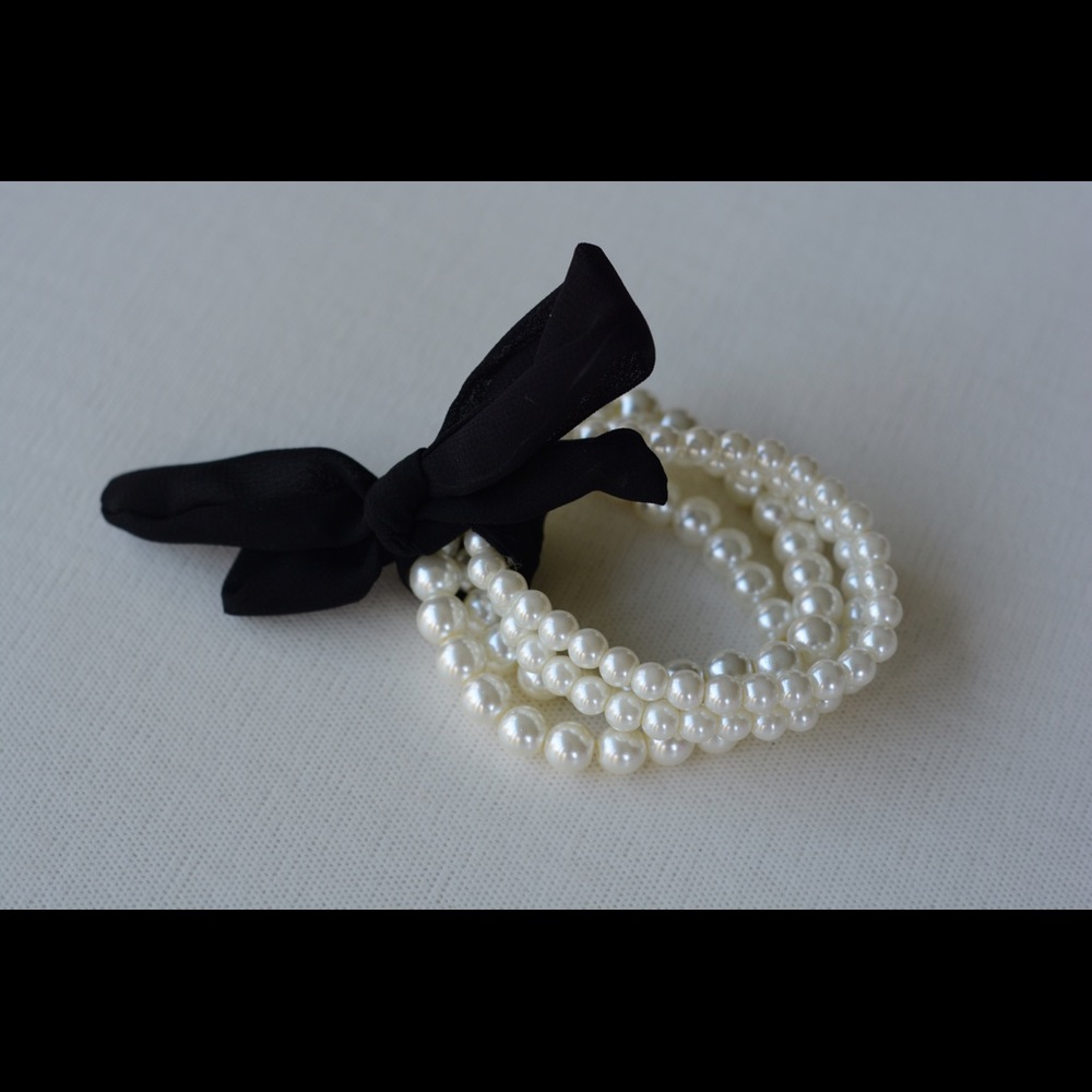 Bundle of four faux-pearl bracelets