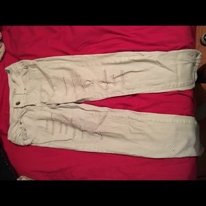 Ripped and cuffed skinny jeans