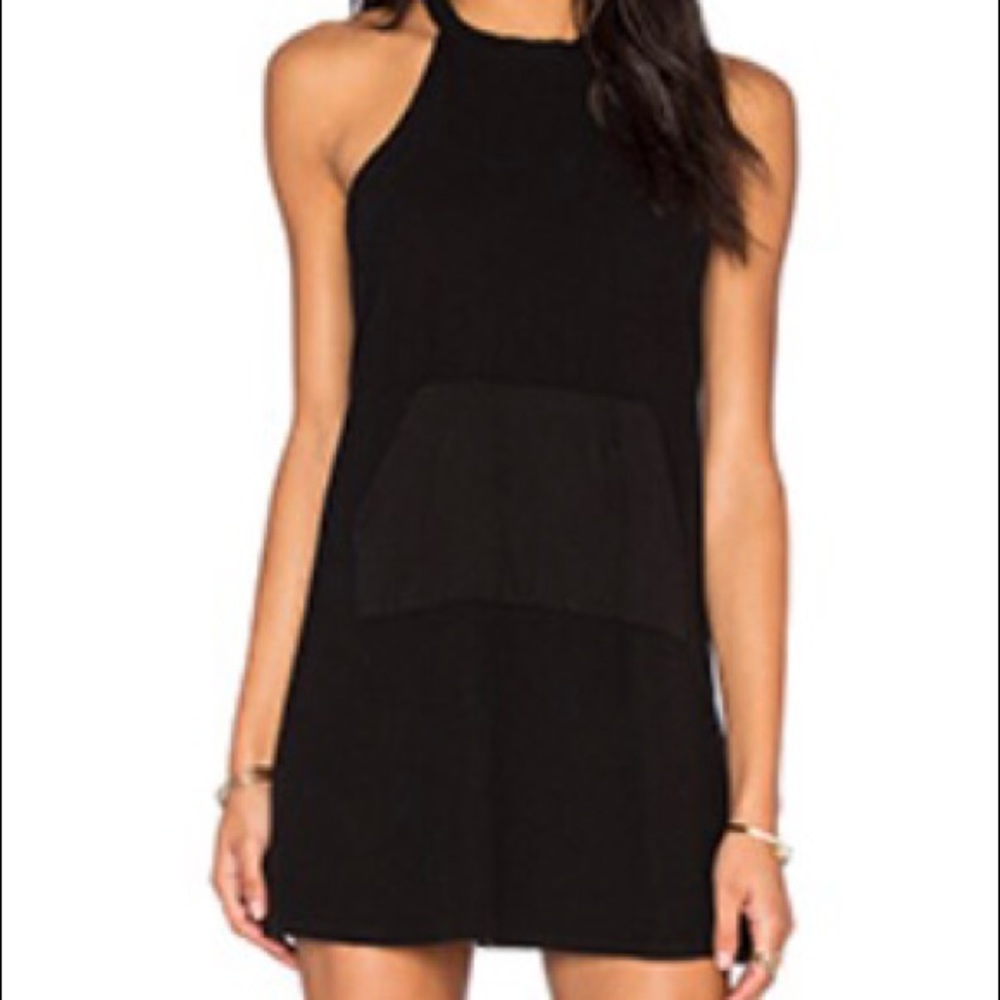 Knit black jumper with high neck and pockets