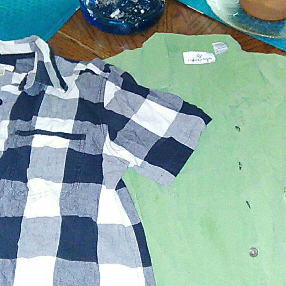 Two button up shirts short sleeves.