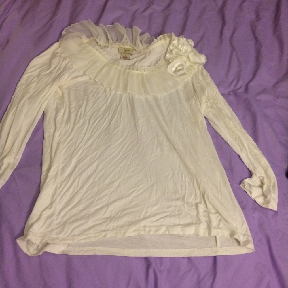 White blouse with flower accent